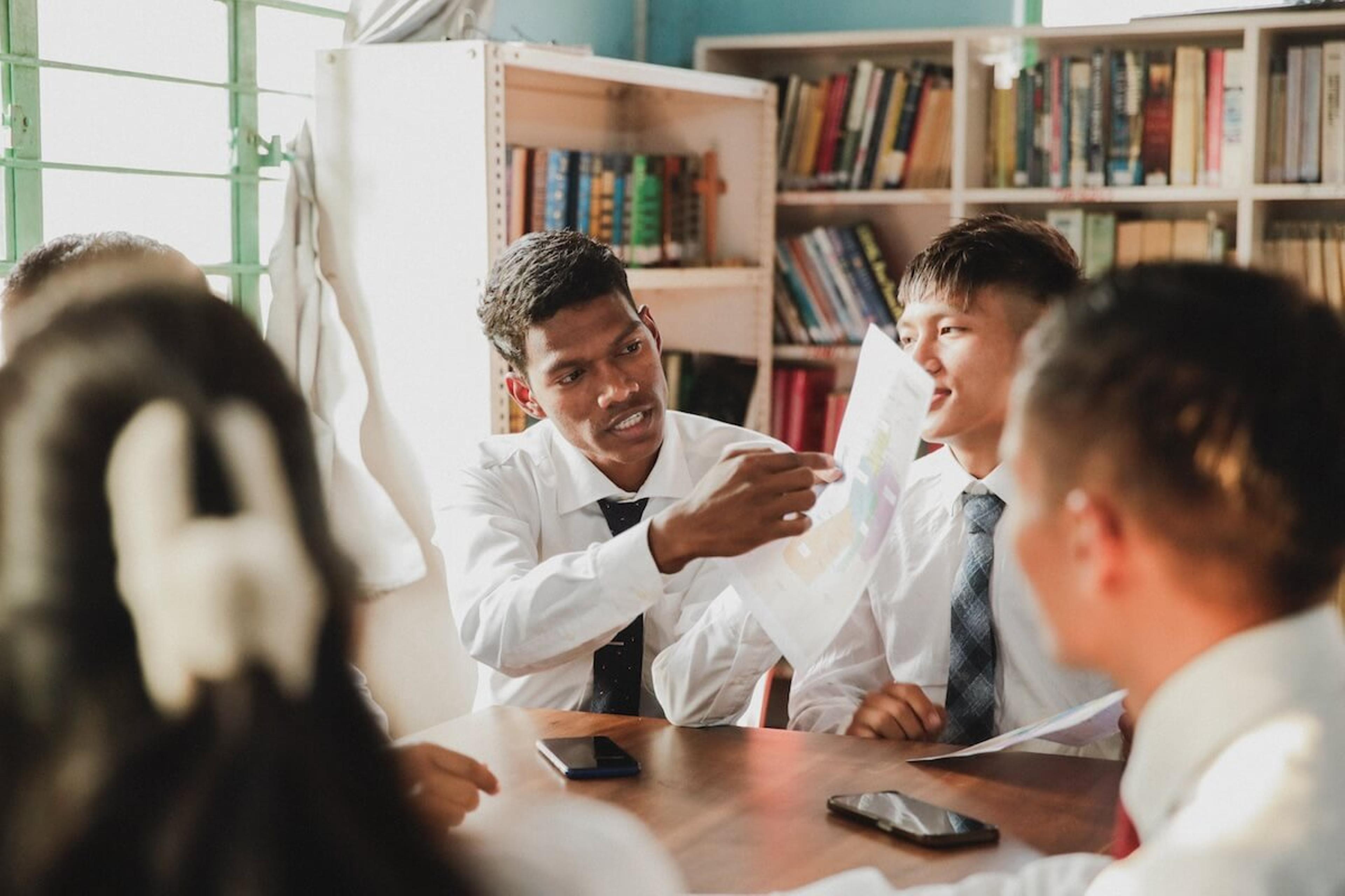 A group of students studying together in a classroom