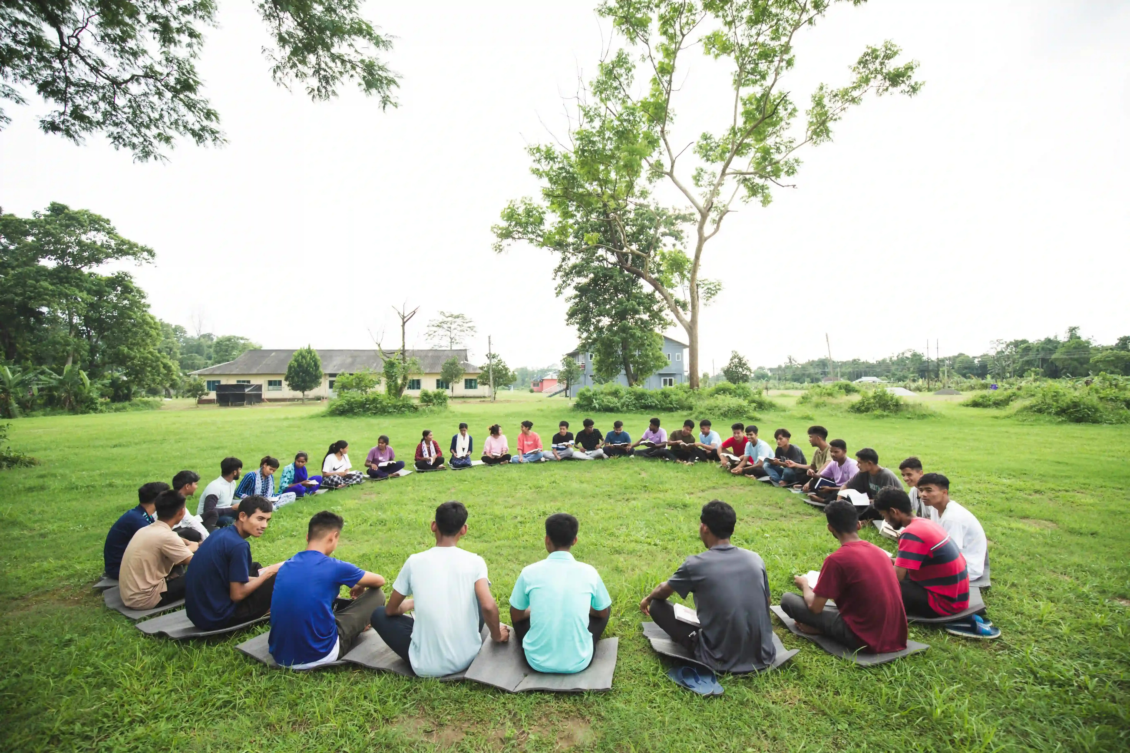 Students sitting together in a lawn